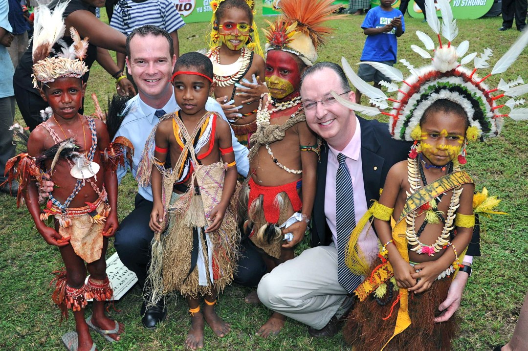 Paul Singer and Mark Fraser with children in Papua New Guinea.
