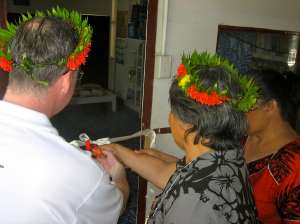 Mark cuts the ribbon with the Minister for Education, the Honourable Maere Tekanene, to officially open the new MAMA Resource Centre.