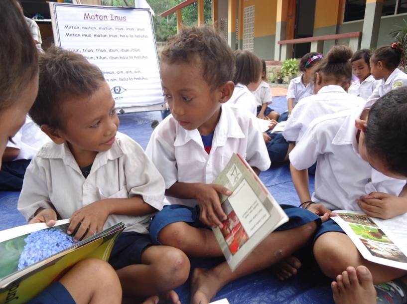 Children in Timor Leste enjoying the new books from the MAMA Mobile Library.