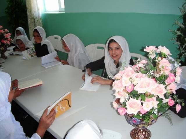 Girls reading books at the new MAMA Resource Centre in the Panjshir Valley, Afghanistan.