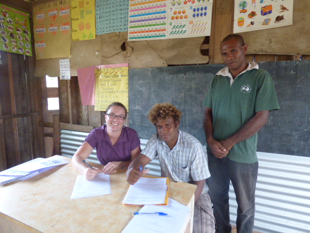 Signing the Building Contract. (L to R: Leigh Pirie, Patteson Amos and Acting Head Teacher, James Qwauna) 