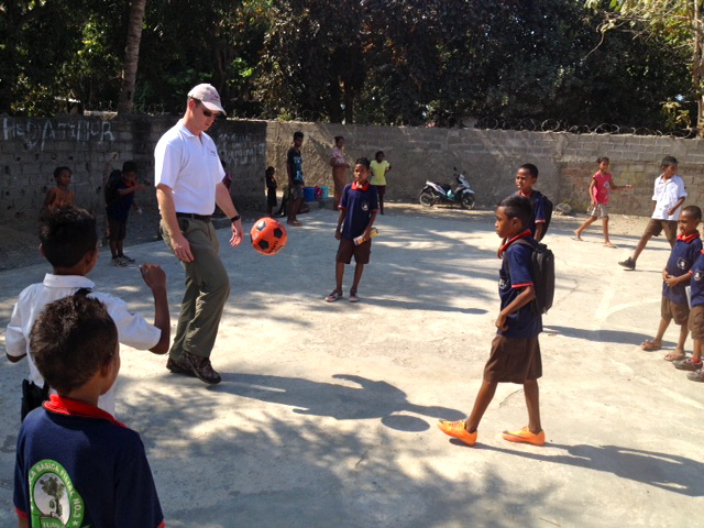 Paul Singer enjoys a game of soccer with the children at Tuana Laran School.