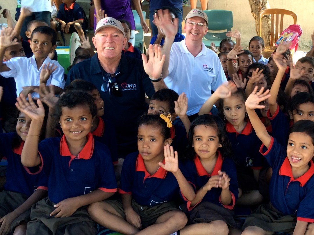 John Fraser and Mark Fraser with the children of Tuana Laran School at the MAMA Mobile Library.