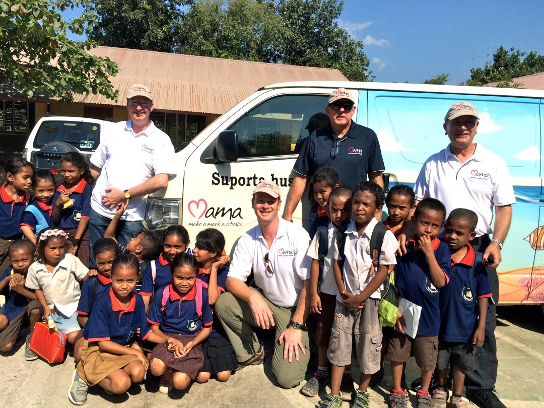 Mark Fraser, Paul Singer, John Fraser and Phil Singer in front of the MAMA Mobile Library which has reached 30,000 children in its first two years of operation.